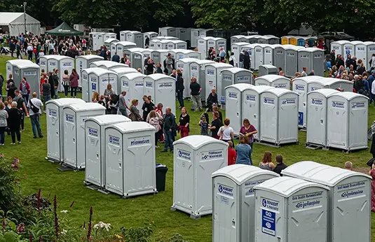 A scene showing a group of portable toilets